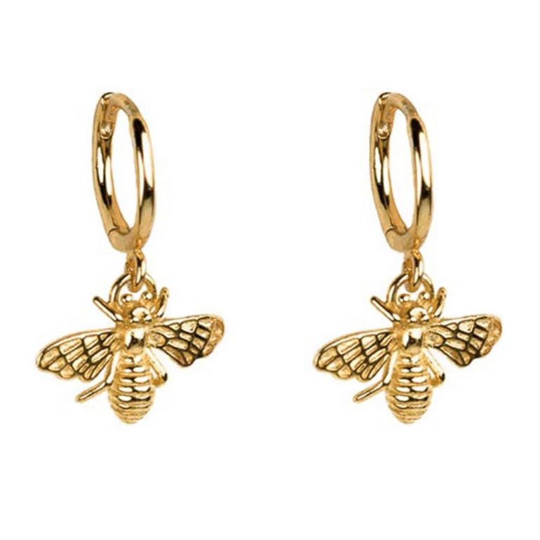 A pair of 18k gold plated sterling silver bee charm huggie hoop earrings for women. Minimalist design with a delicate bee charm hanging from a small diameter hoop. Sold in Sydney, Australia