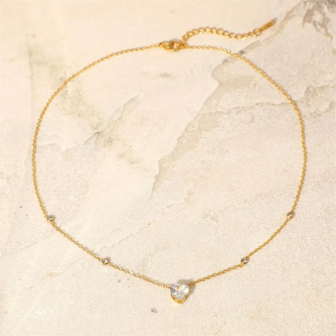 Close-up of a cute, dainty, minimalist tiny pendant necklace, designed in Sydney, Australia.