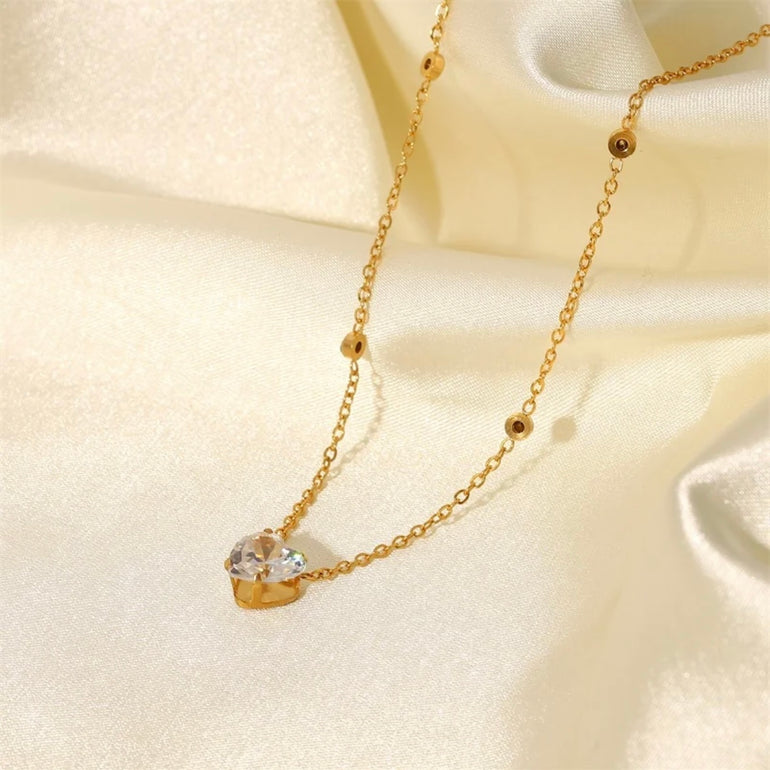 Close-up of a cute, dainty, minimalist tiny pendant necklace, designed in Sydney, Australia.