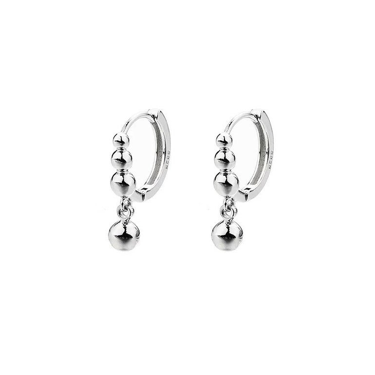 small silver huggie hoop earrings slightly drop and dangle, minimalist style, everyday wear, non tarnish, do not turn your skin green