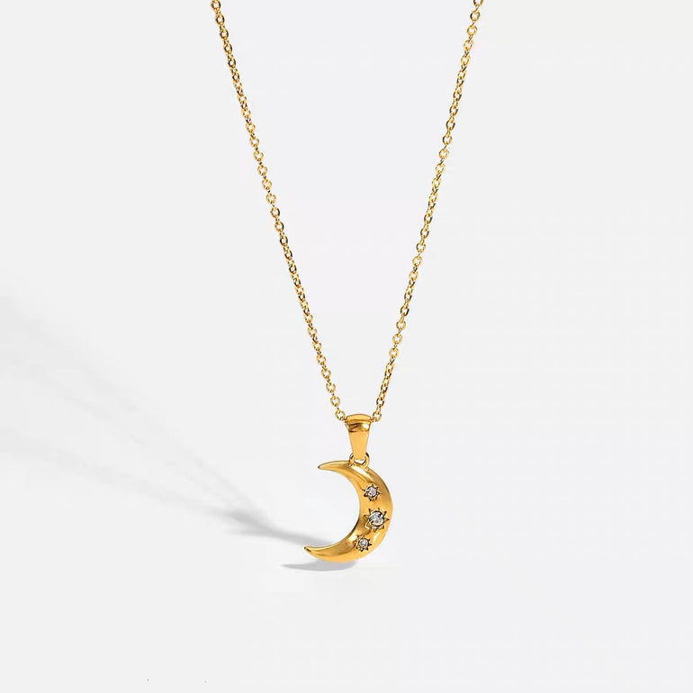 18K solid gold crescent moon pendant and charm necklace for women. The simple necklace has 3 diamonds and real gold that is tarnish free, waterproof and sweat proof jewelry. 