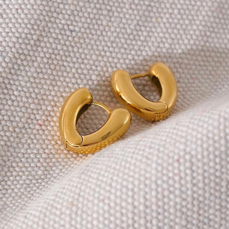 Chunky gold hoops with textured surface and latch-back closure - perfect for festival season and daily wear